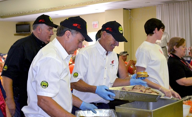 Jim Clark, Dave Murray and Murray Legge serving Ontario Corn Fed Beef In Goderich.